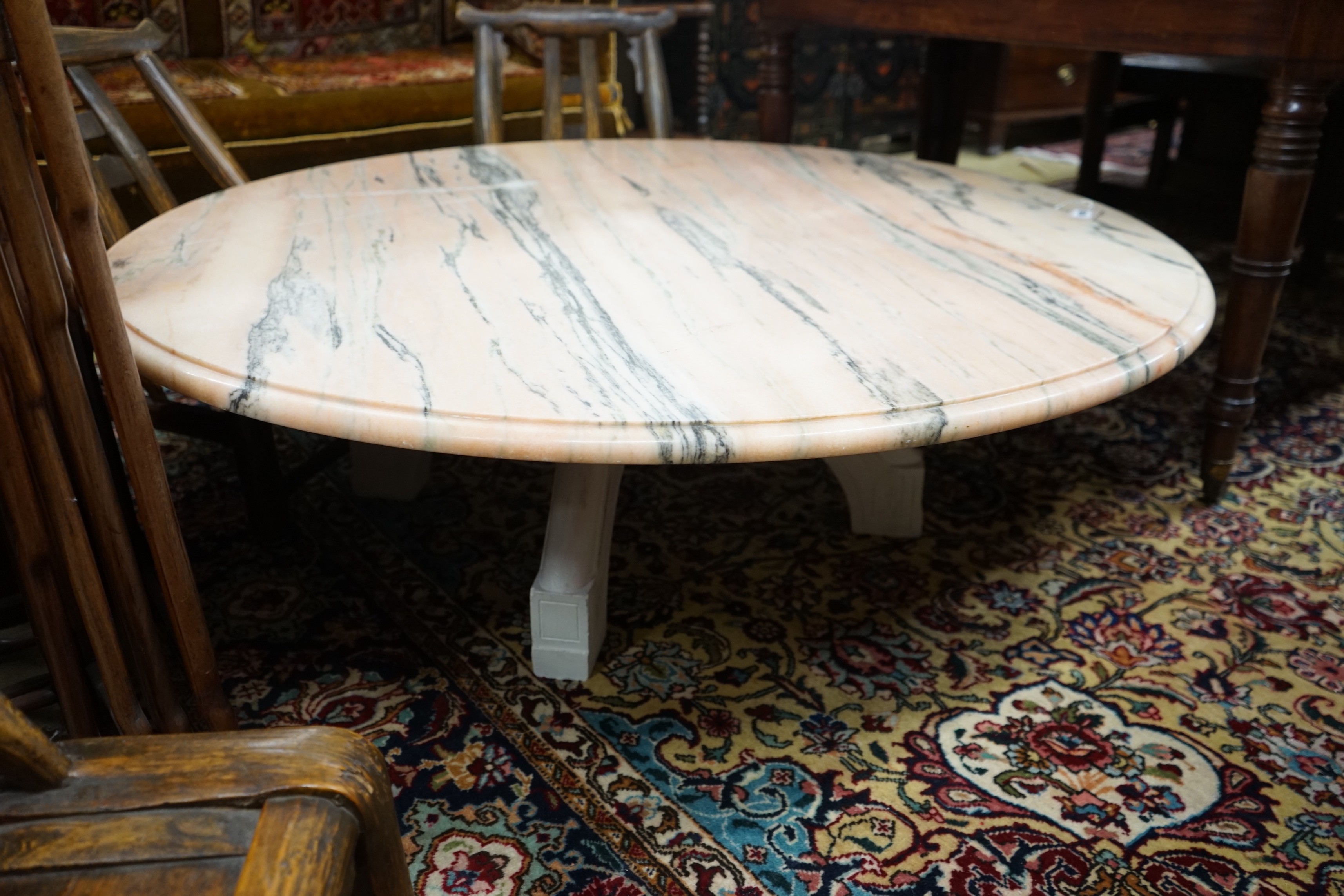 A circular marble top coffee table, diameter 130cm, height 40cm